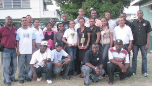 Banks DIH Communications Manager Troy Peters (left) and Sports Manager  Jimmy Ramnarayan (second right) pose with representatives of the competing teams.