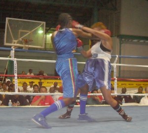 Mandessa Moses (left) trade punches  with Alicia Marques during their encounter.