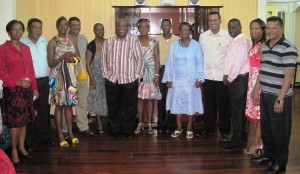 Second from Left Regional Chairman Region Six Zulfikar Mustapha, fourth from  Left Chairperson of Regional Education Committee Mr David Armogan, along with  GTU President Colin Bynoe. Also in picture, Minister Robert Persaud and NCN Coordinator of  Region Six Mr Faizal Jafarally, first from Right, flanked by friends and well wishers of Mr Bynoe.