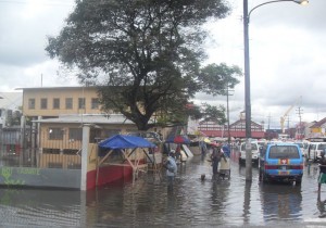 Men at work: This group of men from the city  engineers department risk it all to clear the water way.