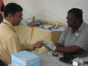 GPL’s Deputy Chief Executive Officer, Aeshwar Deonarine,  testing his glucose level at the power company’s Health Fair.