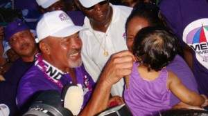 Desi Bouterse interacts with a young Surinamese girl after voting ended.