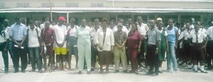 REO Marlyn Jones-O’Donoghue (centre) poses with officials and participants just before the start of play, at the Uitvlugt Community Centre.   