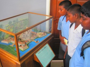 Students view with interest the model of Fort  Zeelandia, a Dutch fort on the Essequibo River