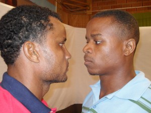 If looks could kill! Troy Lewis (left) and Iwan Azore exchange venomous stares after exchanging vitriolic words.