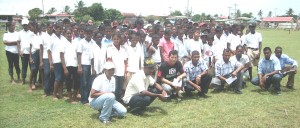 Students pose for a photo op with their teachers shortly before the start of play last Friday at the Skeldon Community Centre ground.  