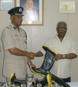 ‘A’ Division Commander, George Vyphius, receives items on behalf of the Police Force, from Executive Director of Food For The Poor (Guyana) Inc., Leon Davis. 