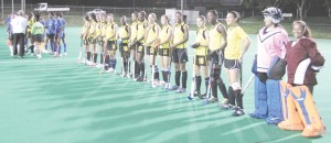 The National Ladies Hockey squad on tour in Barbados line-up just before the start of a match.