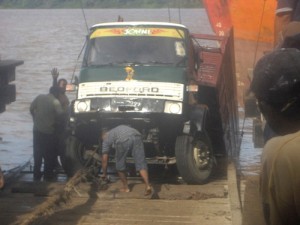 The vehicle being pulled from the river