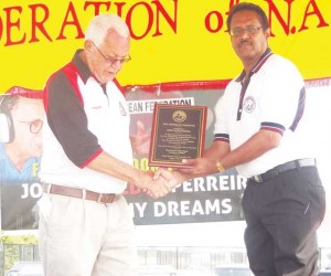 Reds Perreira (left) receiving his award.