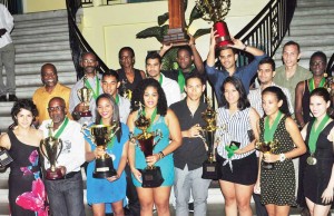 We are the champs! Members of the victorious Guyana Men’s and Women’s teams display their prizes at the presentation ceremony. 