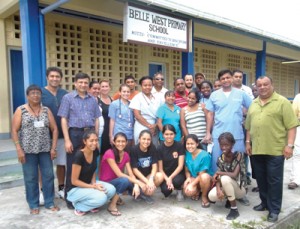 President for the Guyana Watch Team poses with the doctors and local support staff