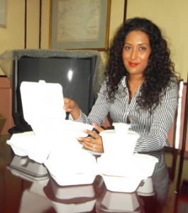 Patricia Bacchus CCI’s Chief Operating Officer displays samples of the various Eco Pak containers 