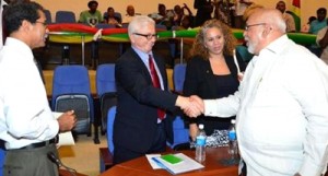 President Donald Ramotar greets IDB Chief of Division, Capital Markets and Finance Juan Antonio Ketterer at the launch of the Micro and Small Enterprise (MSE) project. At left is Guyana Bank for Trade and Industry’s CEO, John Tracey