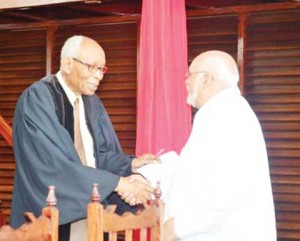 The Reverend Olsen Small greets President Donald Ramotar at the Smith Memorial Congregational Church’s 170th anniversary ceremony (GINA photo)