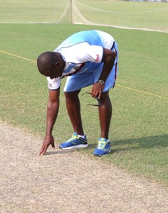 West Indies Manager Richie Richardson takes a close look at the pitch