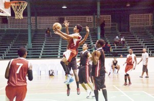 UG Point Guard, Jonathan Pooran goes up in traffic for a layup he made look easy Saturday night at the Cliff Anderson Sports Hall. 