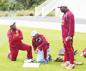 Stuart Williams, Andre Coley and Ottis Gibson chat during a West Indies training session yesterday. (WICB)