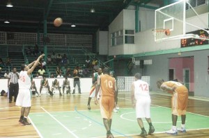 Colts’ guard, Shelroy Thomas (left) sinks the free-throws that sealed Melanie’s fate Saturday night at the Cliff Anderson Sports Hall. 