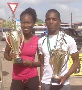  Alika Morgan and Kelvin Johnson pose with their trophies in Suriname after winning their male and female categories respectively at Bigi Broki Waka 10km Road Race on Sunday.