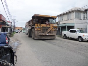 Disruption: This very large truck was one of several that came off a city wharf late yesterday and was being escorted by police when it broke down at Independence Boulevard corner, La Penitence. It was still there late last night.