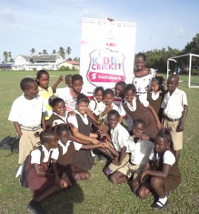 Members of the Philadelphia Primary school team display their trophy after their victory. 