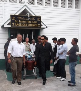 The remains of late Paul Sobryan are taken from the Church yesterday by family members and friends. 