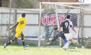  Diamond United’s Nathaniel Paul (left, No. 6) blasts home this shot past Herstelling goalie Quazim Yusuff in the 9th minute.                        