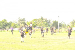 Battle for supremacy between Diamond United (black & orange) and Grove Hi Tech at the Grove Playfield yesterday.    