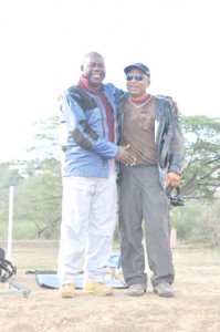 Caribbean Individual Shooting King, Lennox Braithwaite (left) is being congratulated by National Captain Mahendra Persaud after he completed the 1000 yard range yesterday.