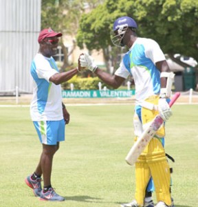 Sir Vivian Richards offers a bit of encouragement to Carlos Brathwaite.