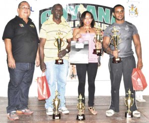 GAPF President Peter Green with the respective Overall winners form right, Roger Calender, Chole Hunter and Winston Stoby.