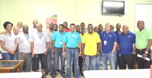 Officials and members of the competing teams in the final take timeout  for a photo. 