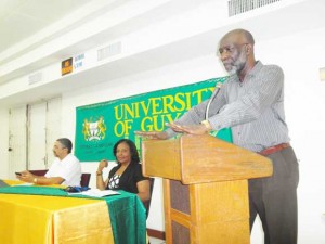 From left: Courts’ Managing Director, Clyde De Haas; UG Librarian Gwyneth George and  UG Registrar, Mr Vincent Alexander (standing).