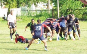 Action in the clash between Pepsi Hornets and the University of Guyana last Saturday, at the National Park.