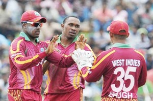 West Indies cricketers Dwayne Bravo (centre), brother Darren Bravo (left) and Carlton Baugh during a previous tour. (Copyright AFP 2014/Lakruwan Wanniarachchi)