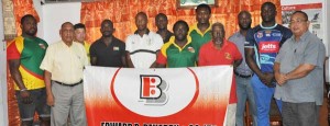 Members of the national team pose for photo op with GRFU President Peter Green (right) and other officials yesterday at Olympic House.