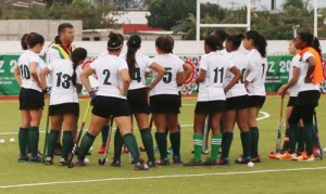 Team Guyana receiving a final briefing before the match.