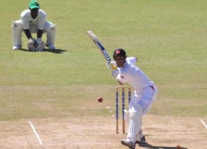 Lendl Simmons launches into a big drive yesterday during his top-score for the Red Force.