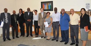 Dr. Phillip M. Thomas (fourth from left) with former U.S. Ambassador to Guyana, Brent Hardt (centre), and other members of the GNCPP