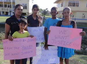 Khatoon’s wife and children on the protest line yesterday outside the Police Commissioner’s Office