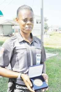  SGT Maurees Skeete shows off her CONCACAF Women’s Championship Medal.