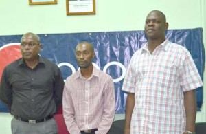 Steve Ninvalle (extreme left), Larry Wills and Terrence Poole (extreme right) shortly after the culmination of the ceremony.