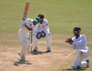 Vishaul Singh gathers runs during his responsible unbeaten 115 yesterday.