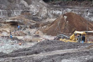 A dredge operating in the goldfields. It is tough, dirty work.