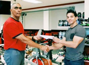 Manager/Owner of Fitness Express Jamie McDonald presents cheque to David Gomes, Flex Night Inc. Director of External Resources.