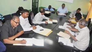 File photo: Members of GAWU and GuySuCo meet in October and agreed on arbitration proceedings.