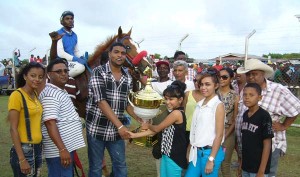 Organiser Nazrudeen (Jumbo Jet) Mohammed Junior presents the three year old West Indies bred trophy to Afiah Shariff of the Shariff Stable.