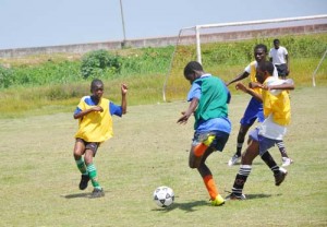 Charlestown in attack: Caption- A player from Charlestown (with green bib) seen in attack during their clash against Freeburg yesterday.