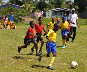 Action in the Grove Hi Tech (blue & yellow) Diamond United match at the Grove ground yesterday.            